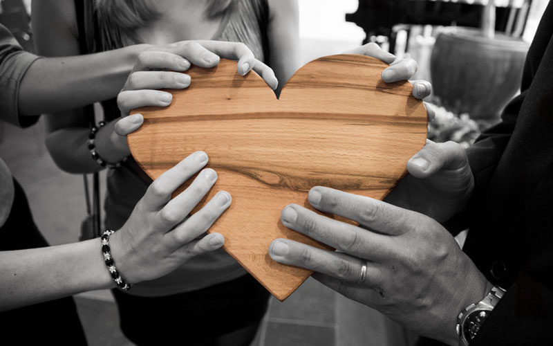 People holding heart shape