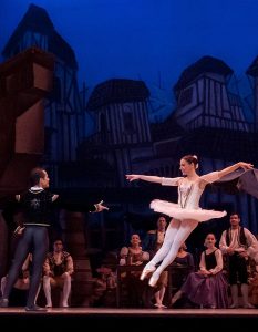man and woman dancing in a theater