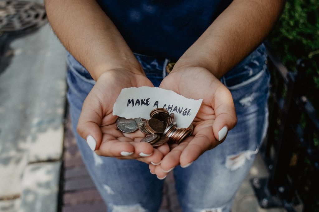 lady holding money for fund raising with note