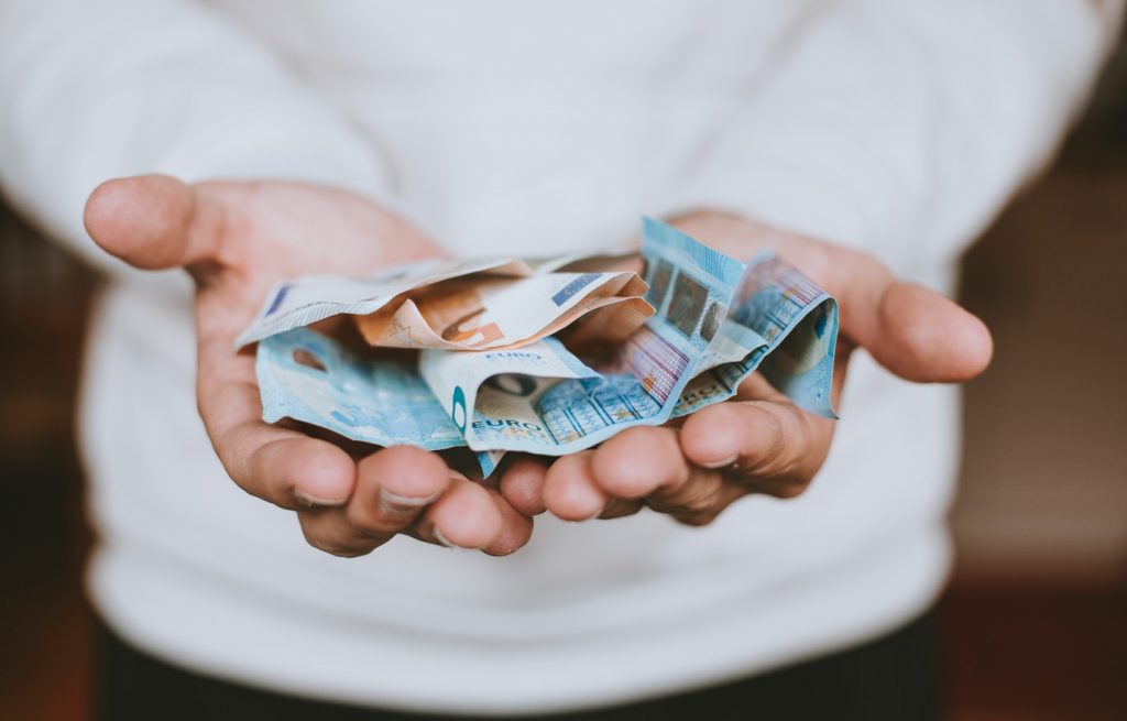 Man giving money as donation