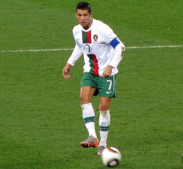 person playing soccer in a field