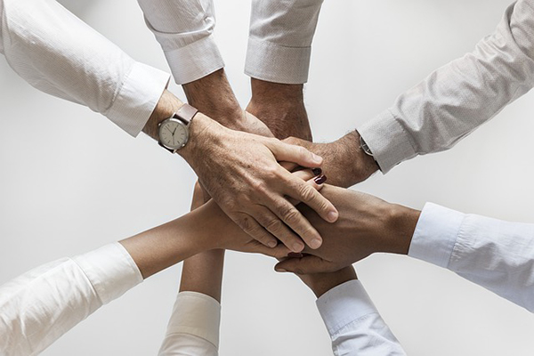 Group of hands holding together