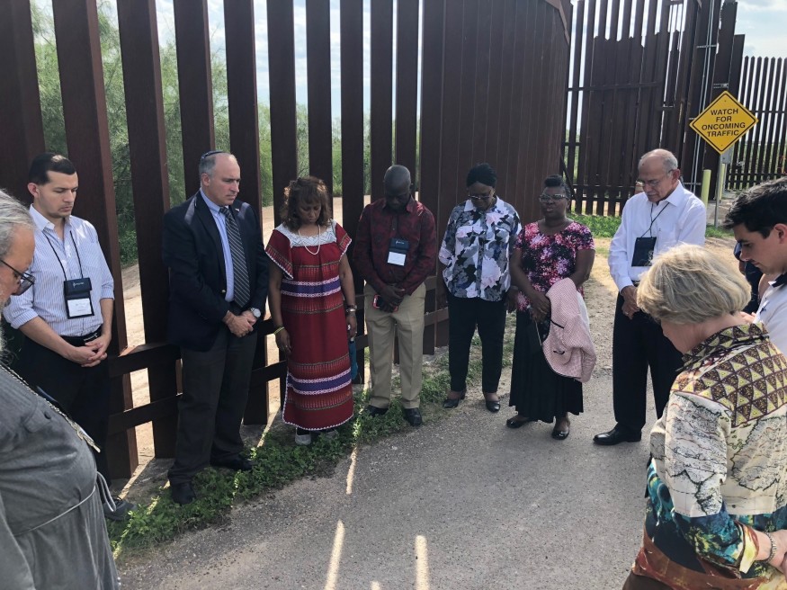 a group of people praying