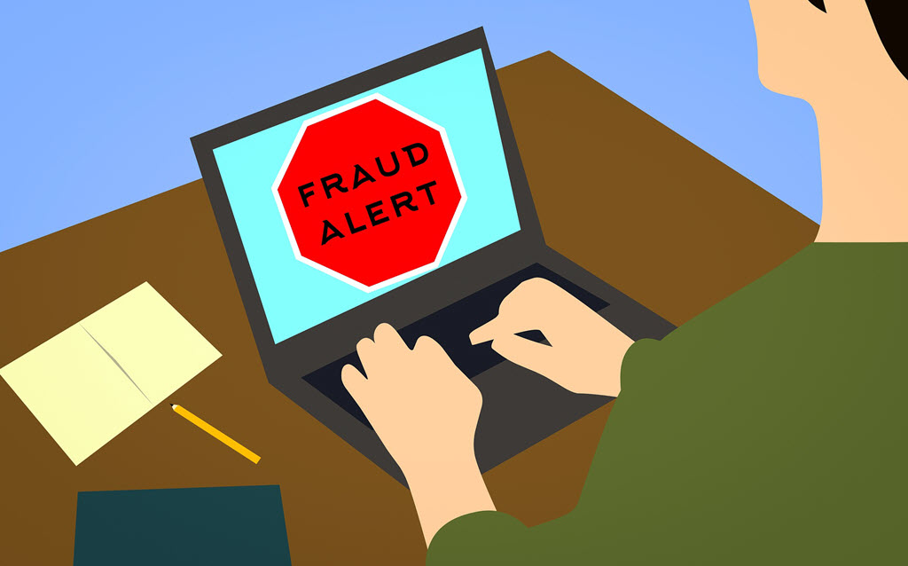 digital drawing of a laptop with "fraud alert" appearing on its screen while being used by a man